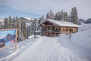 Old farmhouse witchcraft in winter during the day Söll